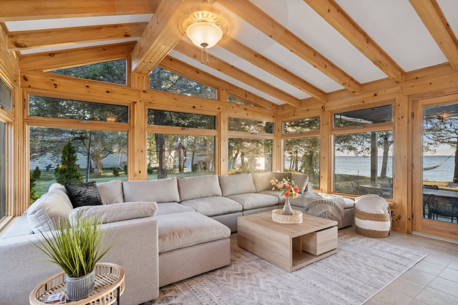 Bright natural-wood sunroom lounge