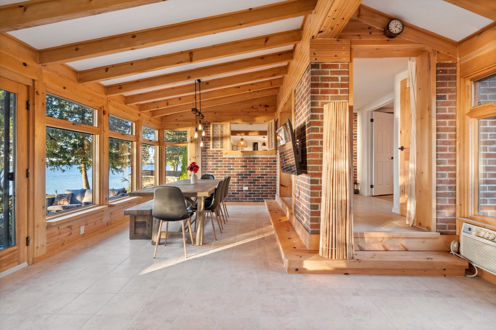 Natural-wood sunroom connected to the main home