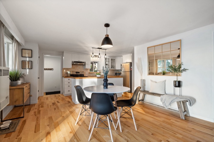 Round dining table for four, open to the kitchen